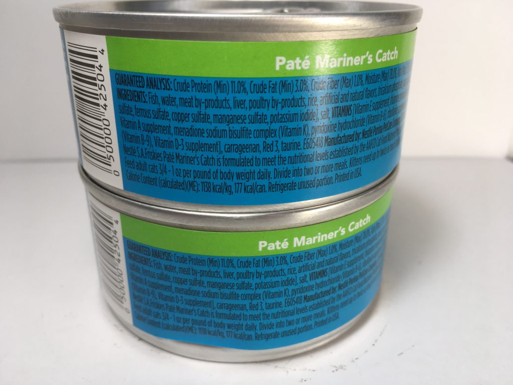 The back of two cans of delicious cat food stacked together, friskies, pate, Mariner's Catch